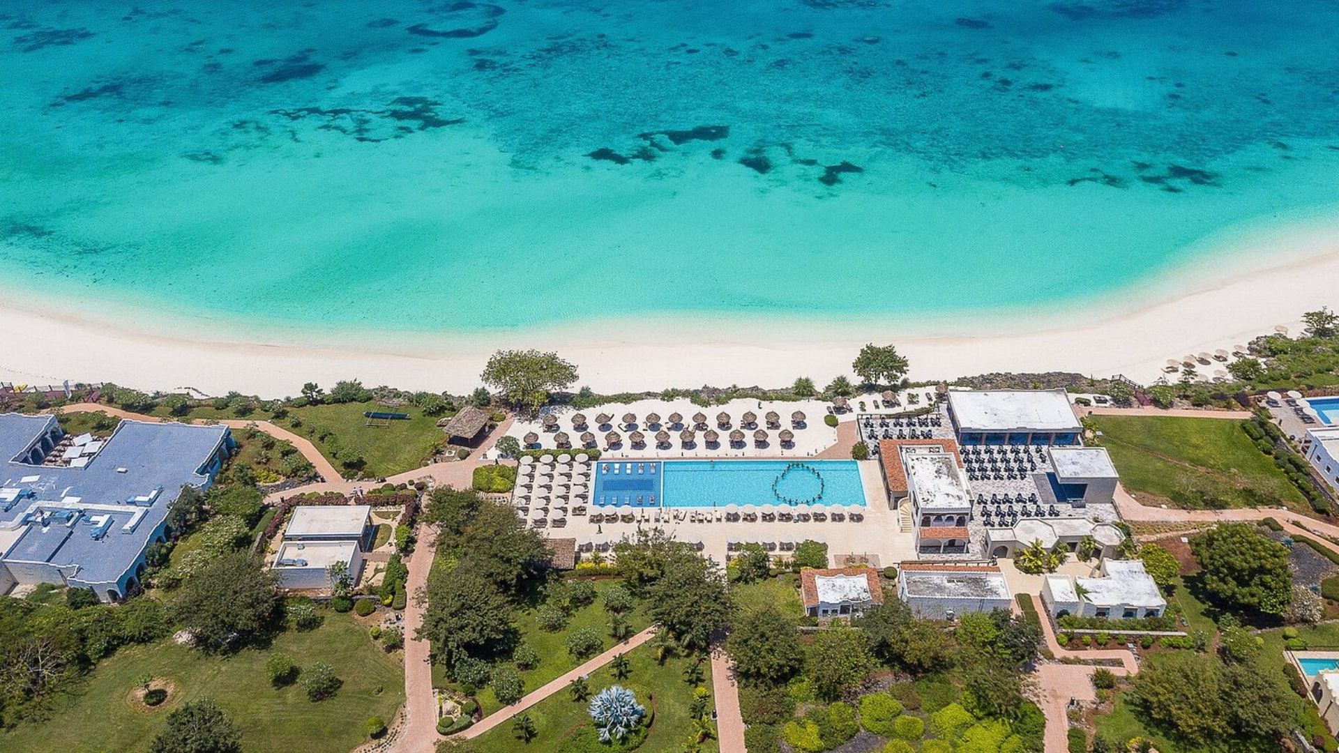 Riu Palace Zanzibar: A luxurious adults-only resort in Nungwi, featuring elegant rooms, upscale dining experiences, a spa, and a beautiful infinity pool overlooking the ocean.